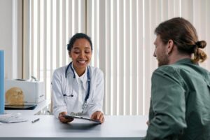 Primary care doctor consulting with patient about preventive health and wellness planning